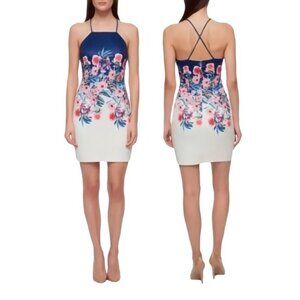 A strappy back adds allure to an apron-front bodycon dress wrapped in flowers -